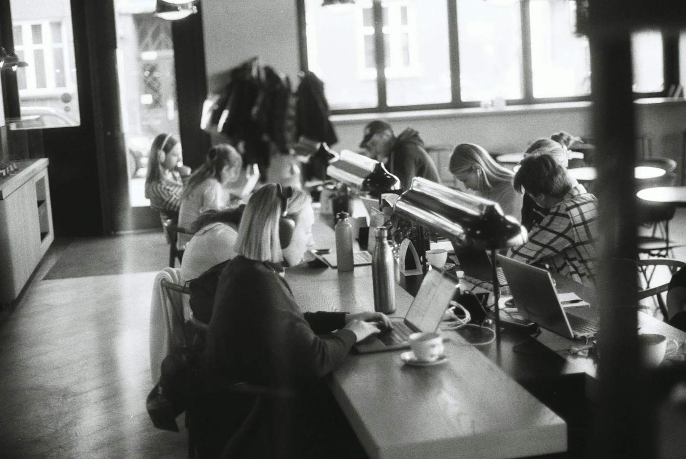 People working at laptops in a café