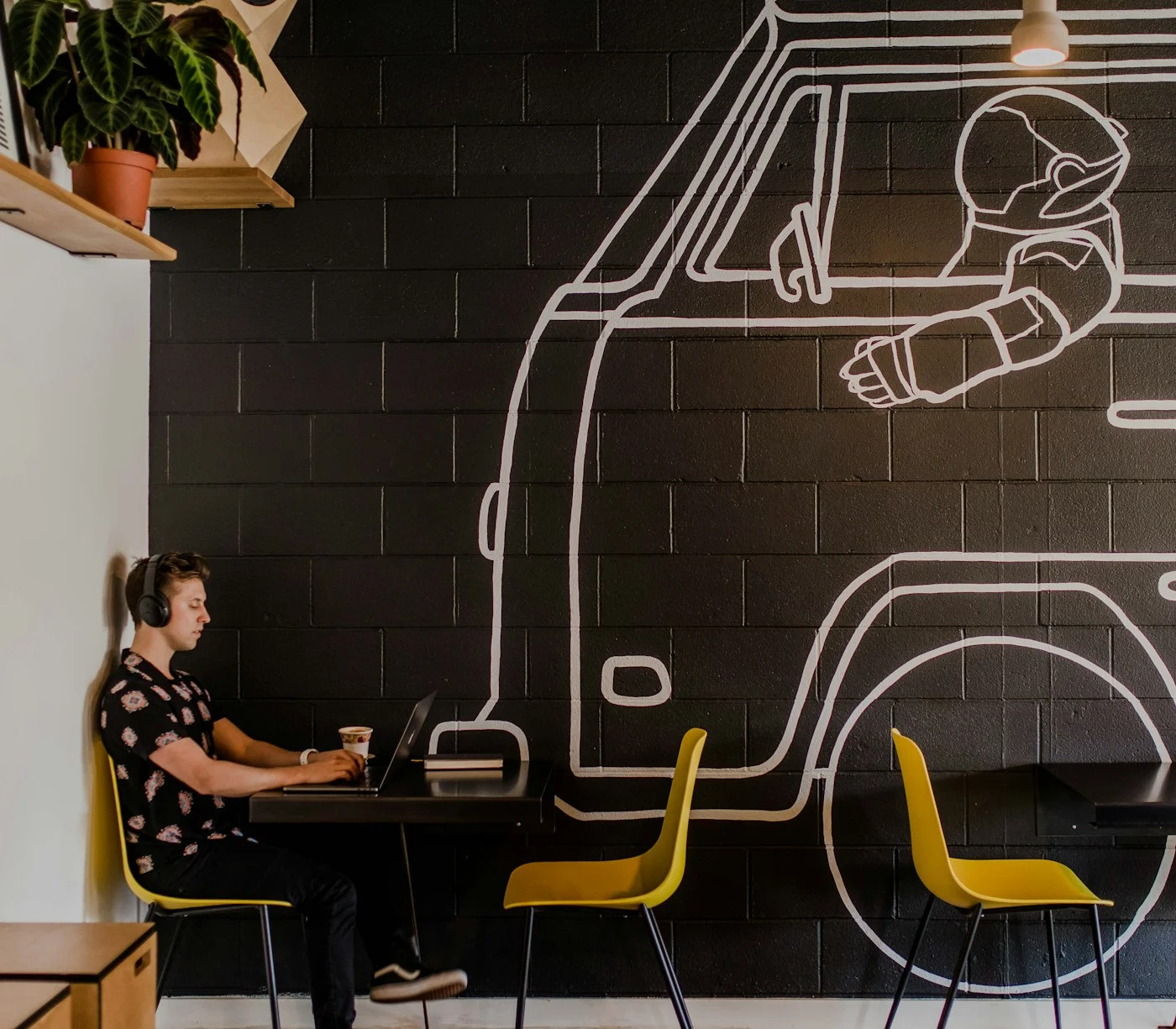 Independent worker using a laptop in a café